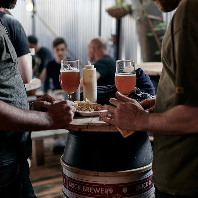 People enjoying beers and food at Brick Brewery, Peckham