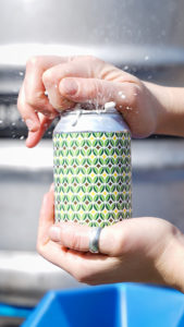 Person opening can of Brick Tamarind & Lime Leaf sour